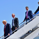US President Donald Trump steps off Air Force One, alongside US Attorney General William Barr (R), Ronny Jackson (2nd R), Candidate for United States Representative for Texas’s 13th Congressional District, and Tommy Tuberville (2nd L) Candidate for United States Senate from Alabama.